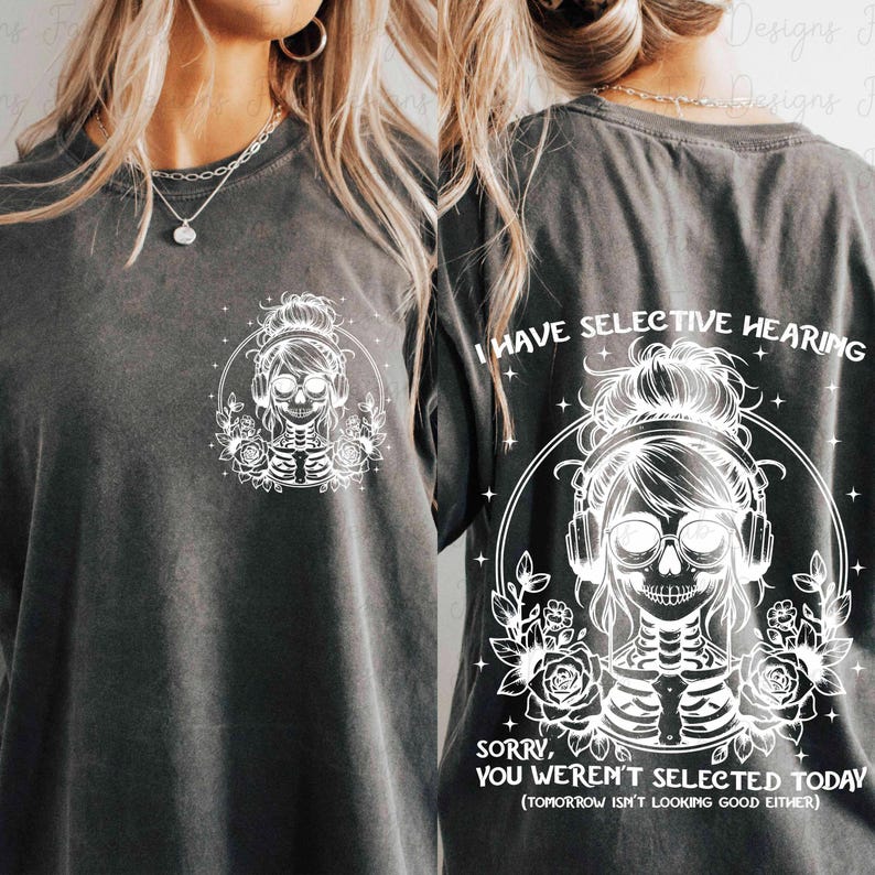 May include: A black t-shirt with a white graphic of a skeleton wearing headphones and a bun. The text "I have selective hearing" is above the graphic and the text "Sorry, you weren't selected today (tomorrow isn't looking good either)" is below the graphic.