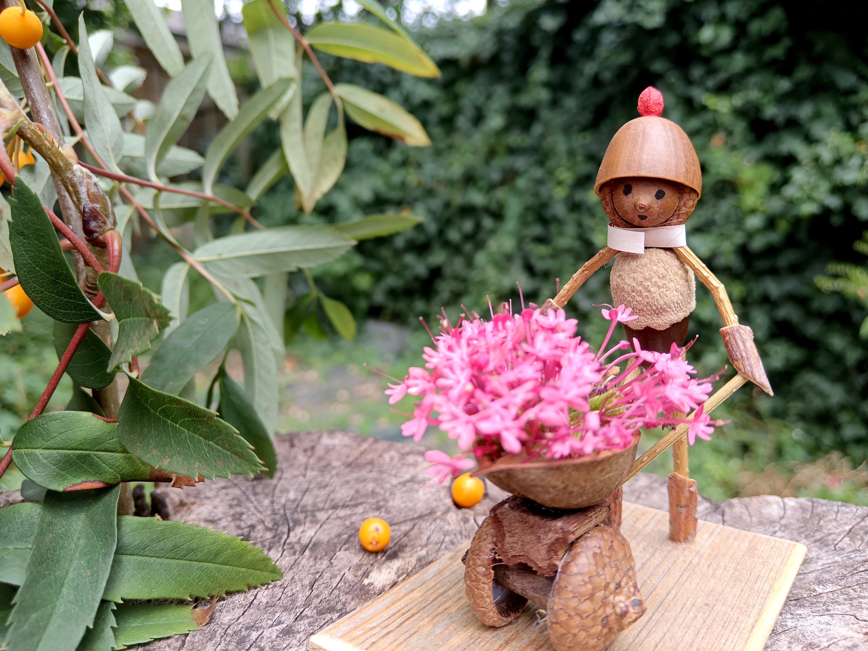 Little Oak Folk  a gardener with a wheelbarrow. Perfect for nature lovers and gardening enthusiasts.