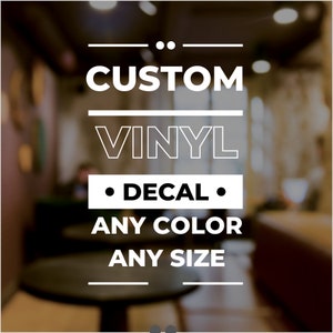 May include: Custom vinyl decal in any color and size. The decal is white with black text that reads "CUSTOM VINYL DECAL ANY COLOR ANY SIZE".