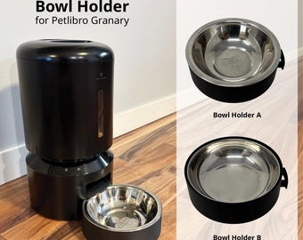 以下が含まれることがあります： Petlibro Granary自動給餌器用の黒い交換用ボウルホルダー。Bowl Holder AとBowl Holder Bの2つのオプションがあり、どちらも円形の黒いベースと取り外し可能なステンレス製のボウルで構成されています。