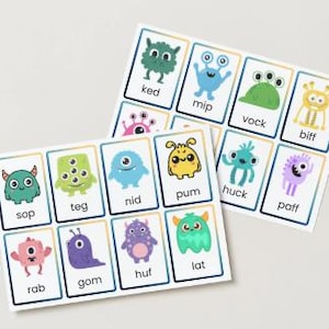 Op de afbeelding: Twee sets flashcards met kleurrijke monsterillustraties. Elke kaart heeft een uniek monsterontwerp en een woord van drie letters. De kaarten zijn gerangschikt in een raster, waarbij elk monster is gelabeld met een woord zoals "ked", "mip" en "vock".