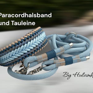 May include: A light blue and tan braided dog collar and matching leash set. The collar features a woven design with silver hardware. The leash has matching blue and tan accents. The text "Paracordhalsband und Tauleine" is visible.