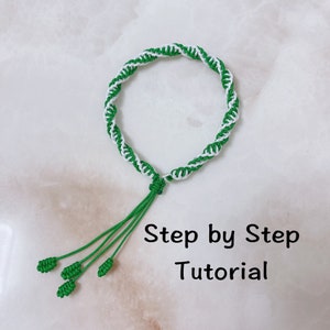 May include: A green and white braided bracelet with a knotted tassel. Step by Step Tutorial.