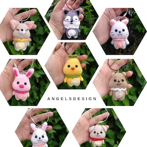 May include: A collection of eight crocheted animal keychains. The keychains feature a variety of animals, including a wolf, a bunny, a chick, a dog, and a cat. The keychains are all made with soft yarn and have bright colours.