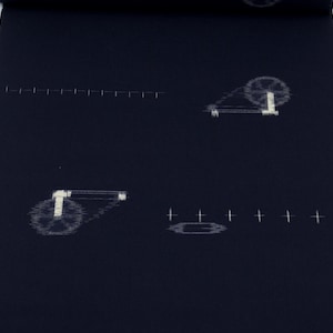 May include: A dark blue fabric with a white pattern of spinning wheels. The fabric has a tag with the text "¥19800".