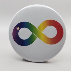 May include: A white button with a rainbow infinity symbol. The symbol is a continuous loop, representing endless possibilities.