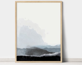 May include: Abstract watercolor painting in shades of blue and gray, depicting a landscape with mountains and clouds. The painting is framed in a light wood frame.