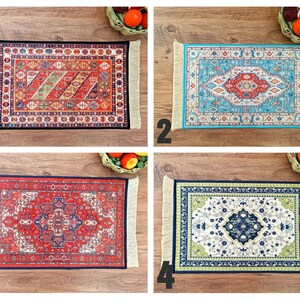 May include: Four different patterned rugs with fringe edges. The rugs are red, blue, green, and white with intricate designs.