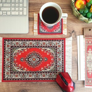 May include: A red and white patterned mouse pad with fringe, a red and white patterned coaster, and a red and white patterned bookmark with the word "BOOKMARK" printed on it.