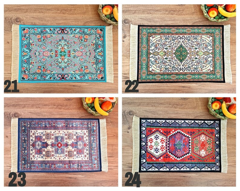 May include: Four different patterned rugs with fringed edges. The rugs are in shades of blue, green, red, and white. The rugs are displayed on a wooden surface.