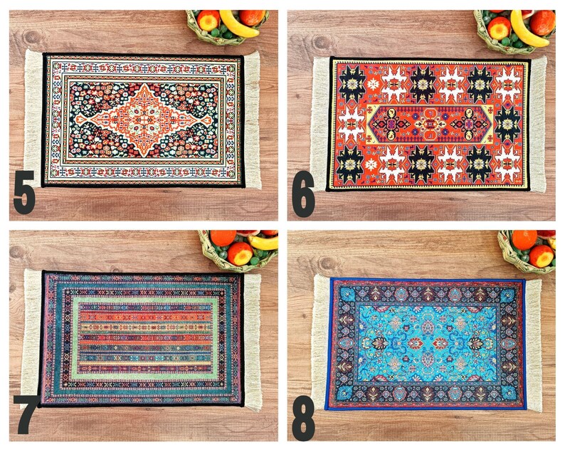 May include: Four colorful patterned rugs with fringed edges. The rugs are displayed on a wooden surface.