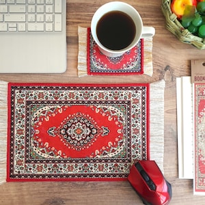 May include: A red and white patterned mouse pad with fringe, a red and white patterned coaster, and a red and white patterned bookmark with the text "Wonder Woven Card Bookmark".