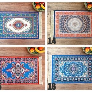 May include: Four colorful patterned rugs with fringe edges. The rugs are displayed on a wooden surface. The rugs are all different designs and colors, including blue, red, orange, and white.