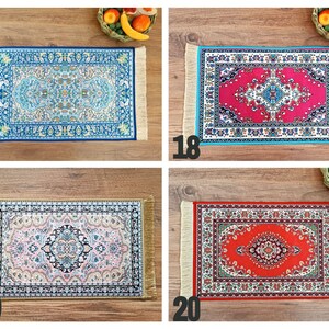 May include: Four different patterned rugs with fringed edges. The rugs are blue, red, pink, and red with a white border. The rugs are all on a wooden surface.