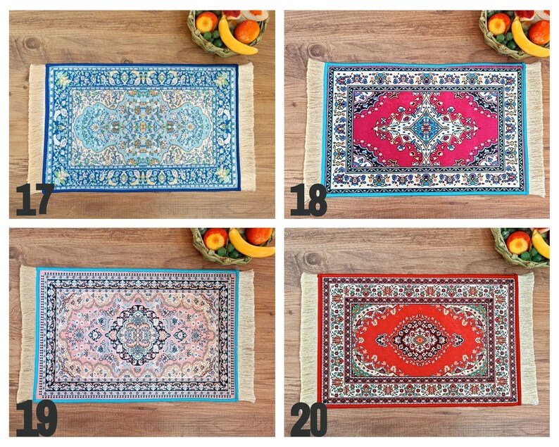 May include: Four different patterned rugs with fringed edges. The rugs are blue, red, pink, and orange. The rugs are all the same size and shape.