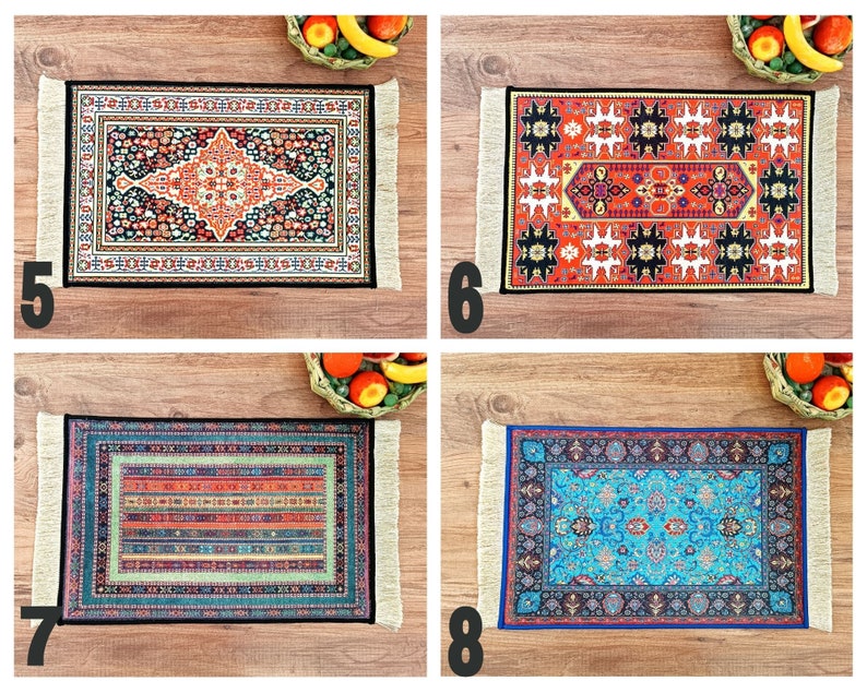 May include: Four colorful patterned rugs with fringed edges. The rugs are displayed on a wooden surface with fruit bowls in the background.