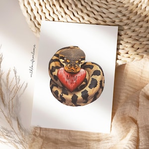 May include: A brown and black snake holding a red heart with the word "MOM" on it.