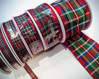 May include: Rolls of plaid ribbon in red, green, yellow, and brown. The ribbon is in a classic tartan pattern, with a glossy finish. The rolls are stacked, with one partially unrolled, showing the full pattern. The text "Eoinandatex" is visible.