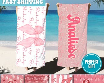 May include: A set of four pink and white beach towels with different designs. Each towel features a different name, including "Analiese", "Ever", "Z", and "Emm". The towels have a pink and white bow pattern.