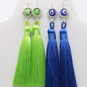 Shoulder Duster Tassel Eyeball Earrings with a circle frame. Hypoallergenic Blue 4 3/4" long or Green 5 1/4" long. X-tra long.