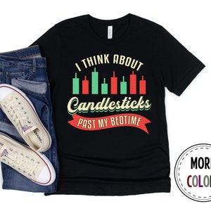 May include: Black t-shirt with a graphic of a candlestick chart and the text "I think about candlesticks past my bedtime".