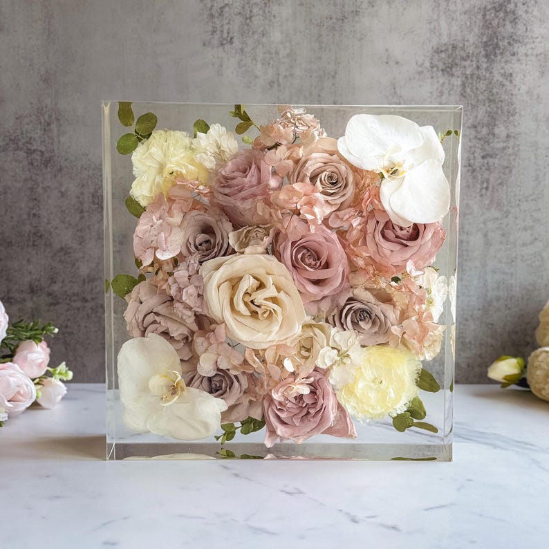 resin block 
wedding flowers in resin block 
bookends 
resin bookends 
flowers preservation 
wedding bouquet preserved
