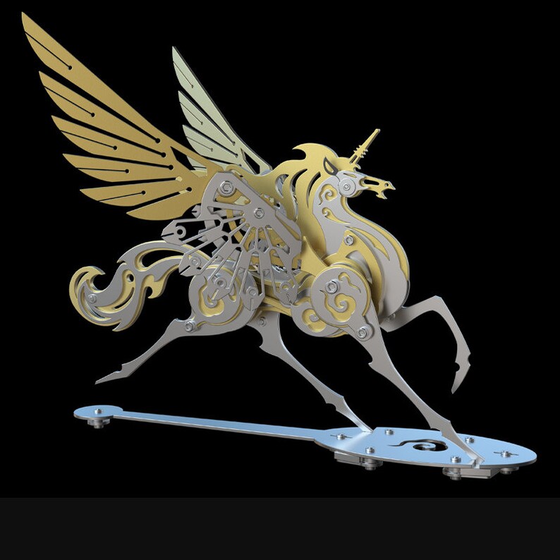 May include: A gold and silver metal sculpture of a winged unicorn with intricate details. The unicorn is in a running pose with its wings spread out. The sculpture is mounted on a metal base.