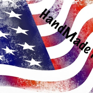May include: A red, white, and blue American flag with a distressed, faded look. The flag is waving in the wind. The text "Handmade in USA" is written in black on the flag.
