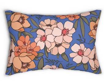 Peach Florals Lumbar Pillow in muted peach & orange shades Bright blue base Includes pillow insert Fresh spring summer tropical vibe