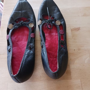 Ladies flat slip on shoes with interesting leather detail