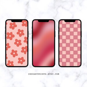 May include: Three phone mockups displaying different pink and red patterns. The first mockup features a pink background with red flowers. The second mockup has a gradient background with pink and red shades. The third mockup shows a pink and red checkered pattern.