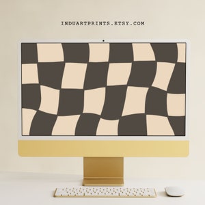 May include: A gold desktop computer with a white keyboard and mouse. The computer screen displays a digital wallpaper of a wavy checkered pattern in black and beige.
