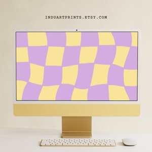 May include: A gold desktop computer with a white keyboard and mouse. The computer screen displays a checkered pattern in shades of yellow and purple.