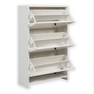 May include: White shoe storage cabinet with three shelves that have flip-down doors. Each shelf has a white, angled, flip-down door.