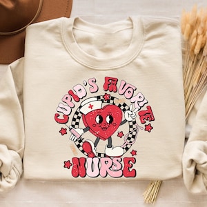 Cupid&#39;s Favorite Nurse Sweatshirt, Nurse Valentine&#39;s Day Shirt  ,Valentine Nurse Shirt, Valentine&#39;s Day Sweatshirt for Nurse, Nurse Gift