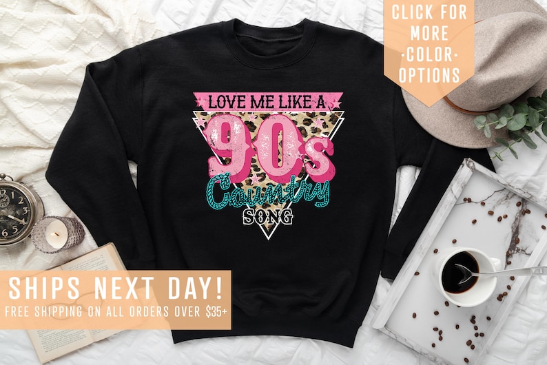May include: Black sweatshirt with a pink and teal graphic that says "Love me like a 90's Country Song" with a leopard print background.