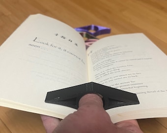 Daumen Buchhalter: Einhändige Buchstütze, Lesehilfe