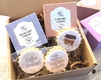 May include: A gift box containing Hazelnut, Caramel, and Irish Cream coffee boxes, each 20g. The box also includes cookies with coffee-themed designs and the phrases "Coffee Fridays" and "Coffee makes everything possible."