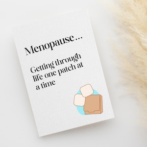 Może przedstawiać: Biała karta z napisem "Menopause..." pogrubioną, czarną czcionką. Poniżej tekst brzmi "Getting through life one patch at a time." Ilustracja plastrów i pudełka znajduje się w prawym dolnym rogu.