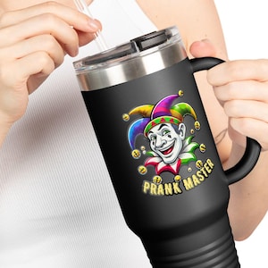 May include: Black stainless steel travel mug with a black handle. The mug features a colorful jester graphic with the text "Prank Master".