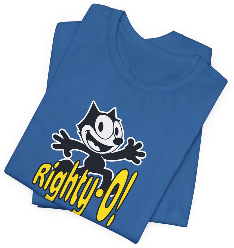 May include: A blue t-shirt with a black and white cartoon cat wearing a yellow hat and the text "Righty-O!" in yellow.