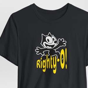 May include: Black t-shirt with a cartoon cat wearing a yellow hat and the text "Righty-O!" in yellow.