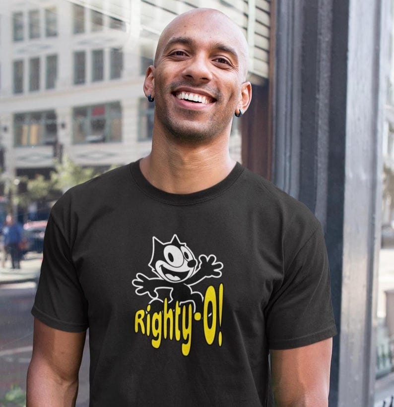 May include: A black t-shirt with a cartoon cat wearing a white shirt and the text "Righty-O!" in yellow.