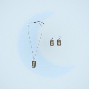 collier / boucles d'oreilles argentés en inox avec pendentif carte oeil et lune