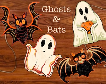 Puede incluir: Decoraciones temáticas de Halloween con un murciélago y dos fantasmas. El murciélago es negro con detalles naranjas, y los fantasmas son blancos con ojos negros. El texto "Ghosts & Bats" está en la parte superior.