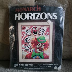 May include: A Monarch Horizons longstitch kit titled "Send in the Clowns." The design features a colorful image of several clowns with red, white, and black makeup. The design size is approximately 16" x 20" (41cm x 51cm).