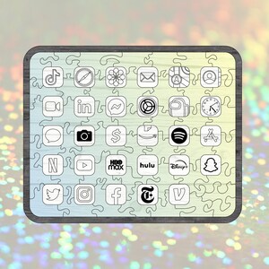 May include: A wooden jigsaw puzzle featuring various app icons, including TikTok, Safari, and Instagram. The puzzle pieces are outlined in black, with a light wood grain background. The puzzle is framed with a dark gray border.