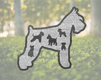 May include: A black and white silhouette of a dog with five smaller dog silhouettes inside. The larger dog is outlined in black and the smaller dogs are filled in black. The background is a blurry image of green grass and trees.