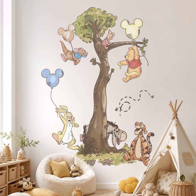 May include: A wall decal featuring Winnie the Pooh characters including Pooh, Piglet, Tigger, Eeyore, Rabbit, and Roo gathered around a large tree. The characters are holding Mickey Mouse-shaped balloons in light blue, pink, and yellow colours.