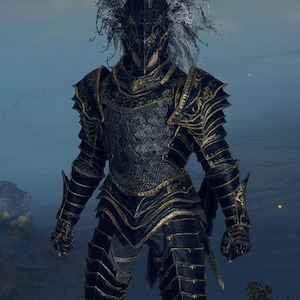 May include: Full body shot of a black and gold knight's armor. The armor has intricate detailing and a helmet with a face covering. The knight's helmet has a white, feathery plume. The armor is worn by a person standing on a rocky surface.